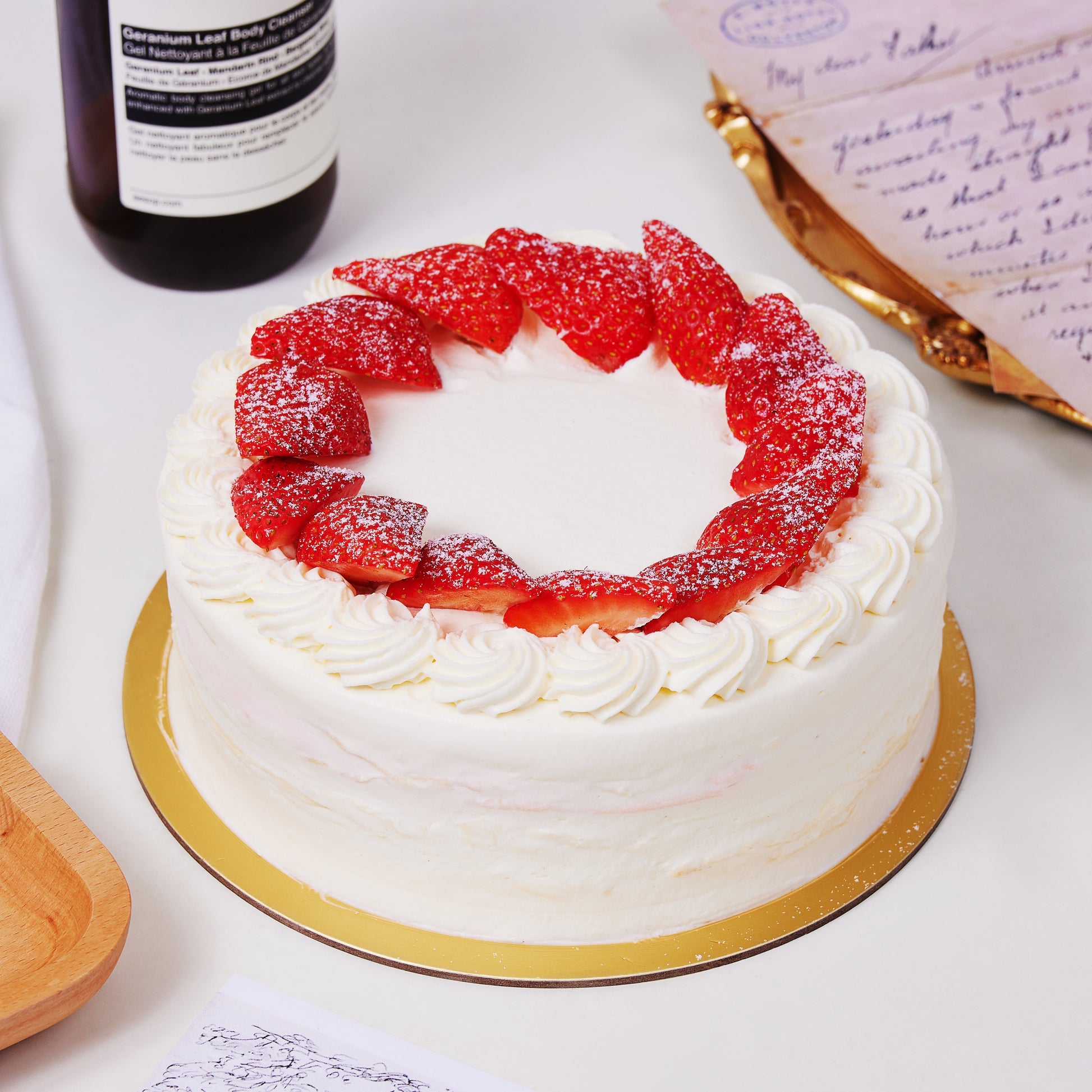 6 inch vanilla crepe cake with strawberry slices on top