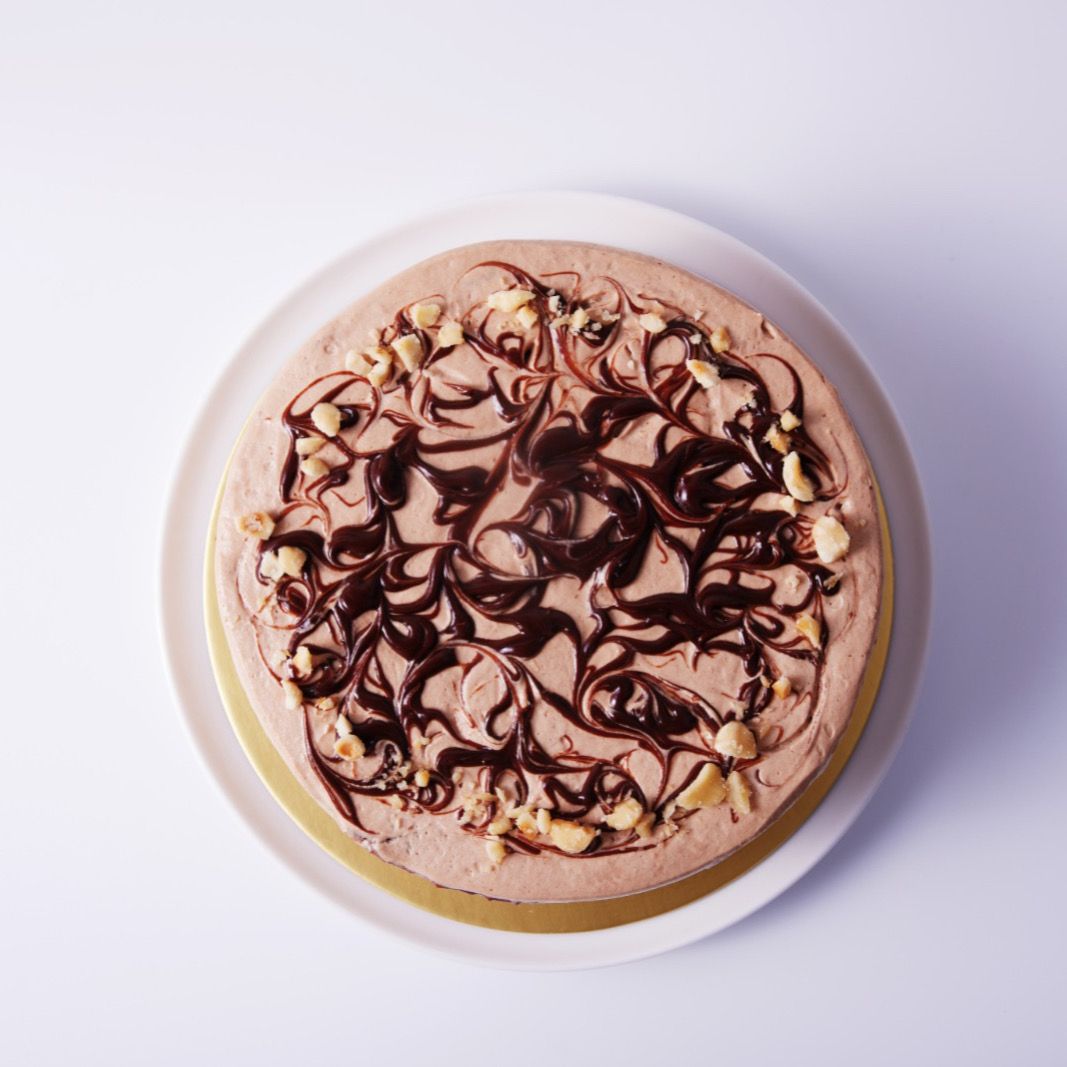 6 inch nutella crepe cake with nuttella chocolate sauce on top